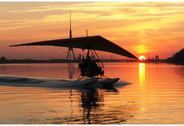 Hang gliding from water or land